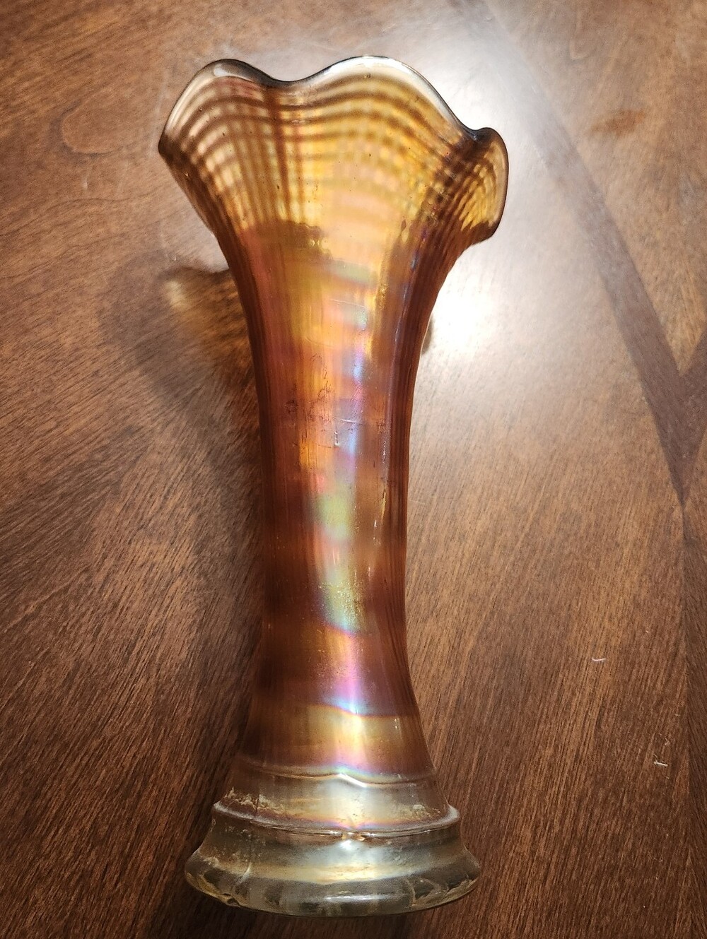 vintage marigold carnival glass bud vase, featuring a ruffled rim and iridescent